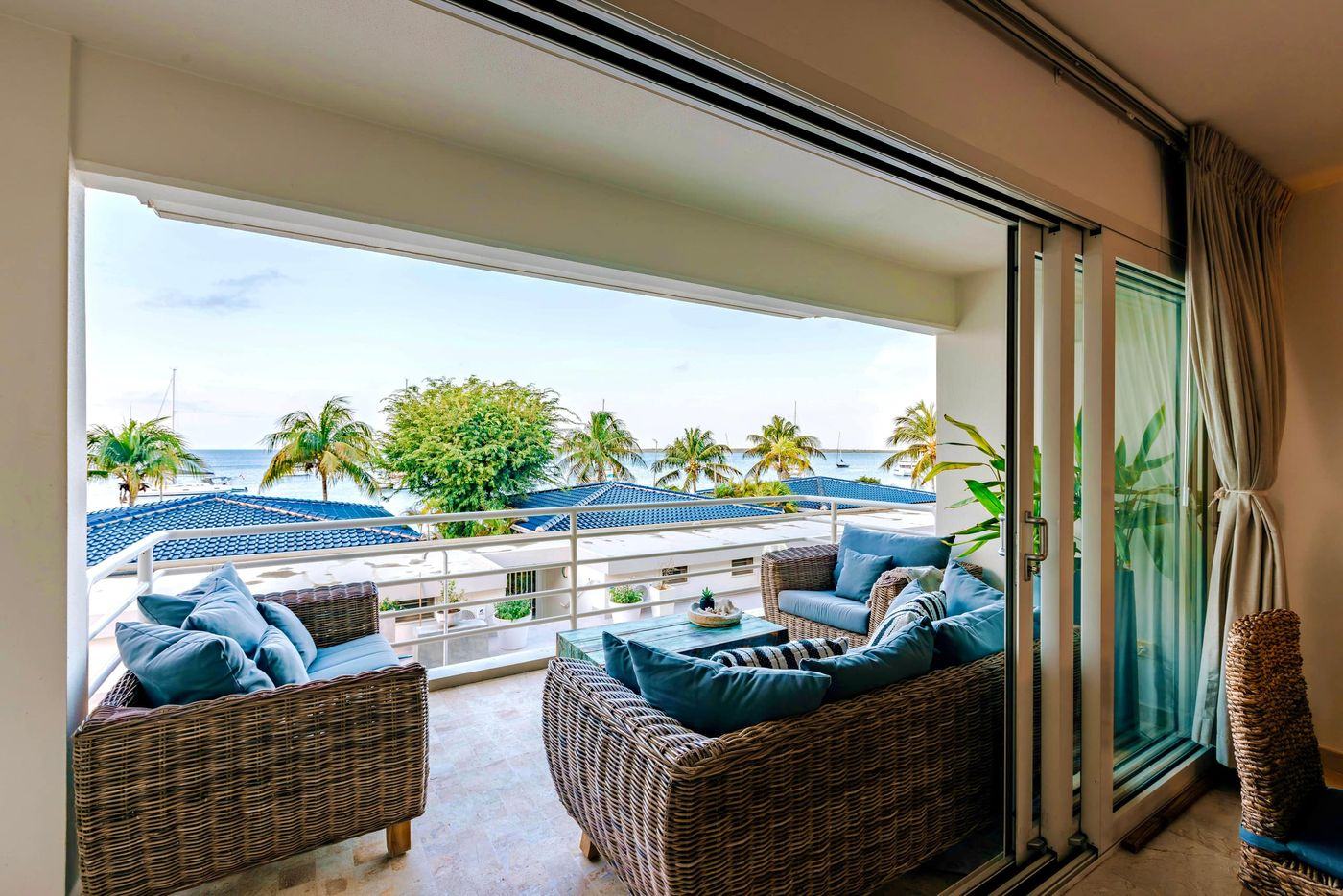 Dolphin living area opening onto the sea-view balcony