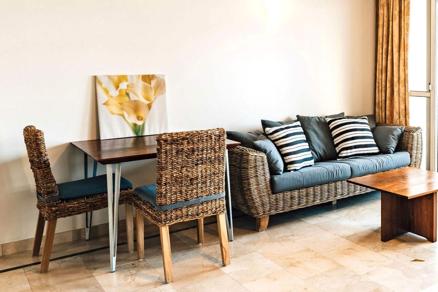 Lounge corner with sofa and dining chairs